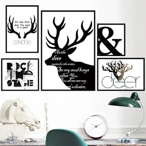 Modern 5-piece black framed wall art set featuring minimalist stag antlers and typography