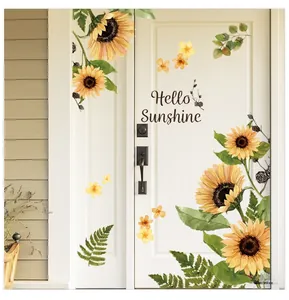 Close-up of sunflower wall decals and Hello Sunshine text on a white wooden door