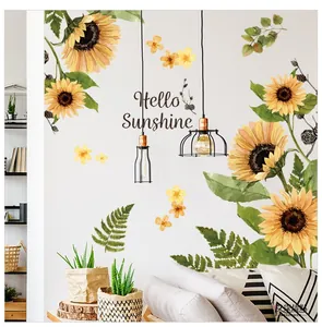 Vibrant sunflower wall decal set with green leaves and Hello Sunshine lettering on a white wall