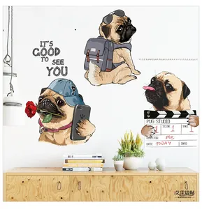 Detailed view of self-adhesive cartoon pug wall stickers on a white bedroom wall