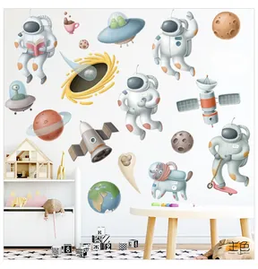 Detailed arrangement of cartoon space wall decals including astronauts and planets in a nursery