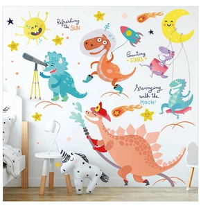 Detail view of cartoon dinosaur wall stickers with space theme for children nursery decor
