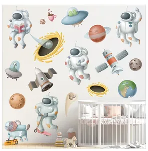 Detailed close-up of cartoon astronauts and planets on a self-adhesive wall sticker