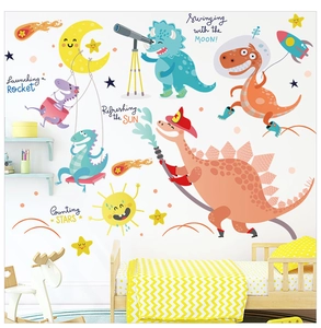 Cartoon dinosaur wall stickers with rockets and stars in a bright child's bedroom setting
