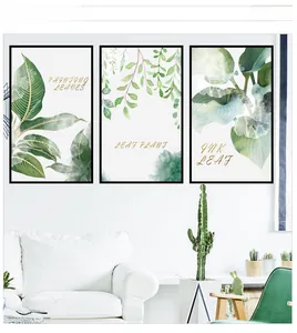 Detail of three-piece Nordic botanical wall stickers with green leaves in a white living room