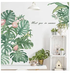 Close-up of monstera leaves and pink flowers wall decal with Meet you in summer text