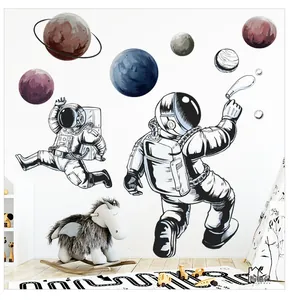Detailed wall sticker layout featuring cute astronauts and colorful planets in a kids room