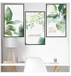 Close-up of triptych green leaf wall stickers with minimalist black frames for home decor