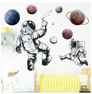 Detail of cartoon astronaut and colorful planet wall stickers for kids room decor