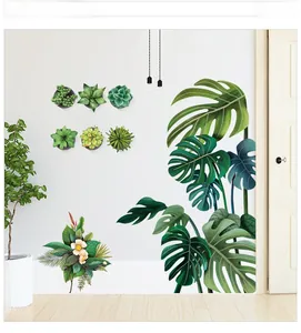 Détails de stickers muraux monstera et succulentes sur un mur blanc minimaliste