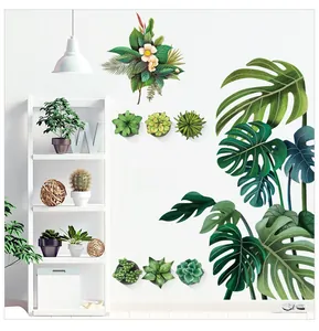 Détail des stickers muraux feuilles de monstera et succulentes peintes dans une pièce moderne