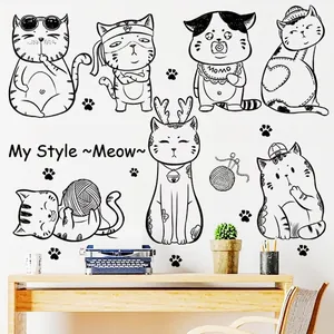 Minimalist black cat wall decals in various playful poses for living room decoration