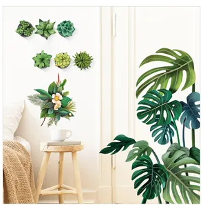 Détail de stickers muraux botaniques avec feuilles de monstera et plantes succulentes