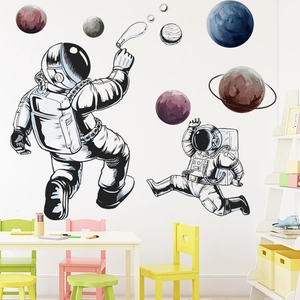 Astronaut wall decals with colorful planets for children's room and nursery decor