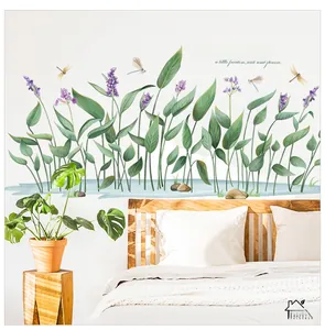 Detailed wall sticker featuring green leaves, purple flowers, and dragonflies on a bedroom wall