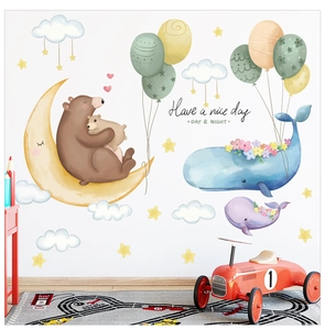 Detail of watercolor whale and bear on moon wall decals for nursery room decoration