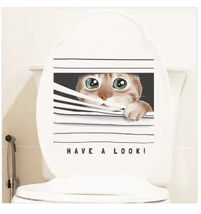 Close-up of a 3D cat peeking through blinds toilet sticker with 'HAVE A LOOK' text