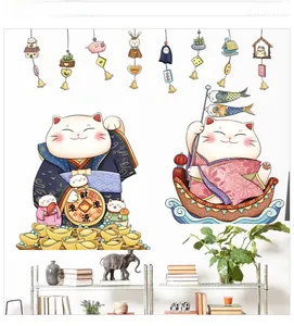 Detail of Japanese lucky cat wall stickers with Fortune greetings on white wall