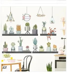 Detail of Nordic wall stickers featuring hand-painted succulents and Nature slogan on a shelf