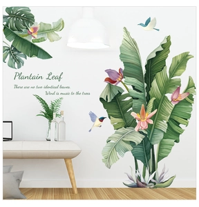 Detail of tropical plantain leaf wall stickers with colorful birds and floral elements
