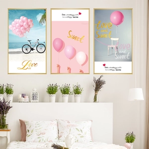 Triptych wall art set featuring pink balloons and bicycle on beach with gold frames