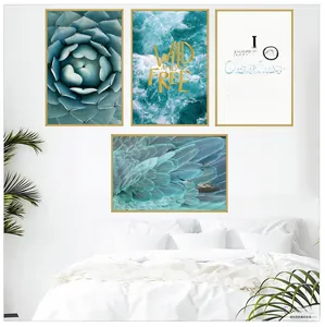 Detail of four-piece modern botanical wall art set with golden frames in a white bedroom
