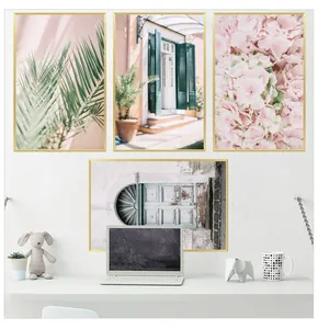 Set of 4 Nordic wall art prints featuring pink flowers and palm leaves with gold frames