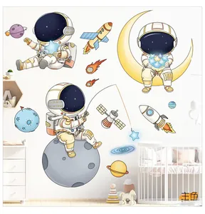 Detail of cartoon astronaut wall decals in a cozy nursery with rockets and stars