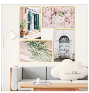Detailed four-piece wall art set with floral and architectural scenery in gold frames