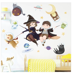 Detail of magical space wizard wall stickers featuring a cat and dog in a nursery