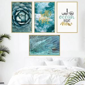 Set of four Nordic sea-themed wall art with gold frames in a bedroom setting