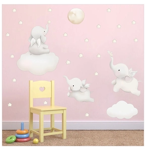 Detail of cartoon elephants and stars wall stickers for a cozy nursery decoration