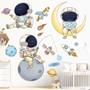 Cartoon astronaut wall stickers featuring planets and rockets in a cozy nursery room