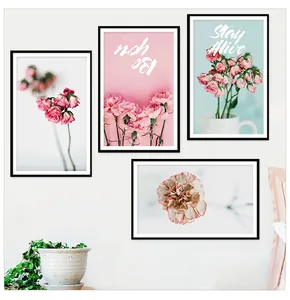 Detail view of pink floral wall art set with black frames for Nordic home decor