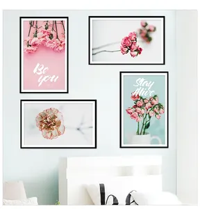 Detailed view of four-piece pink floral wall art with Be You and Stay Alive text