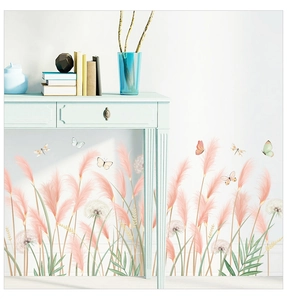 Close-up of reed and dandelion wall stickers with soft butterflies on white background