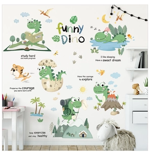 Close-up of cute green dinosaur wall decals and sun motifs on white nursery wall