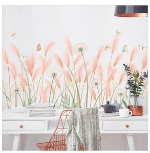 Detail of pink reed and dandelion wall decals with butterflies in a home office setup