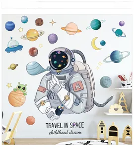 Space wall decals featuring astronauts and planets on white wall in a kid's room