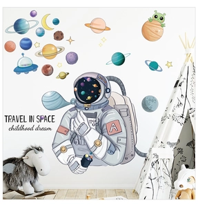 Space themed wall stickers with astronaut blowing bubbles and colorful planets for kids room
