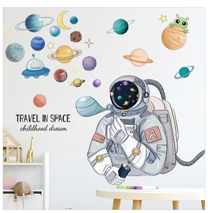 Space wall decals set featuring astronaut, colorful planets, and UFO for kids room decor
