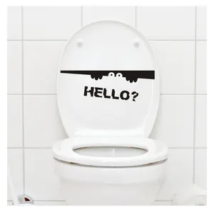 Close-up of waterproof black vinyl toilet sticker with peeking eyes and HELLO? text