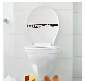 Close-up of waterproof black PVC toilet sticker with eyes design and HELLO text
