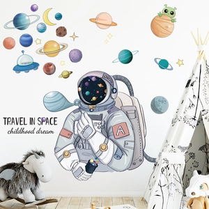 Space theme wall stickers featuring astronauts and planets for a dreamy children's room decor