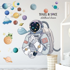 Space themed wall decals with astronauts and planets for children's room decoration