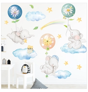 Detail view of watercolor elephant wall stickers with balloons and rainbow in nursery room