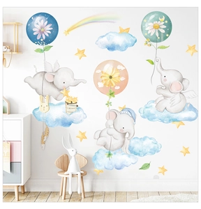 Close-up of cute cartoon elephant wall stickers in a cozy nursery room setting