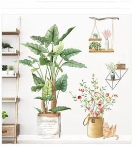 Detail view of watercolor green plant wall decals featuring a cute orange cat and potted herbs