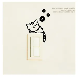 Detail of cute sleeping cat wall sticker with Z sleep bubbles next to light switch
