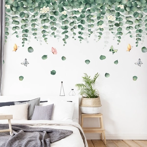 Green eucalyptus leaf wall decal with colorful butterflies for modern living room decor